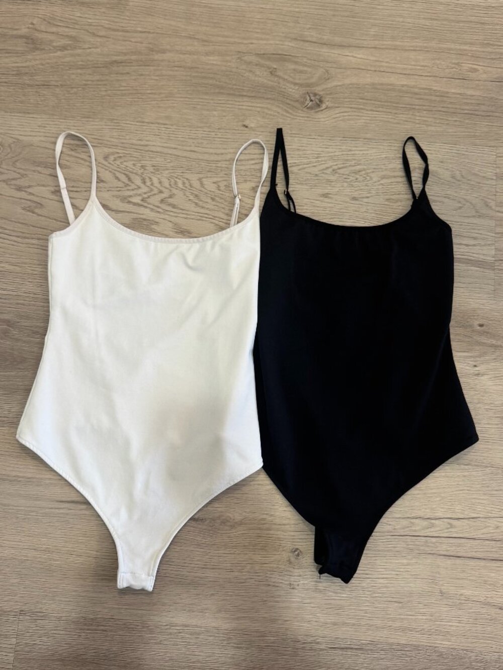 Free People (1) Black & (1) White Tank Bodysuits - sold together